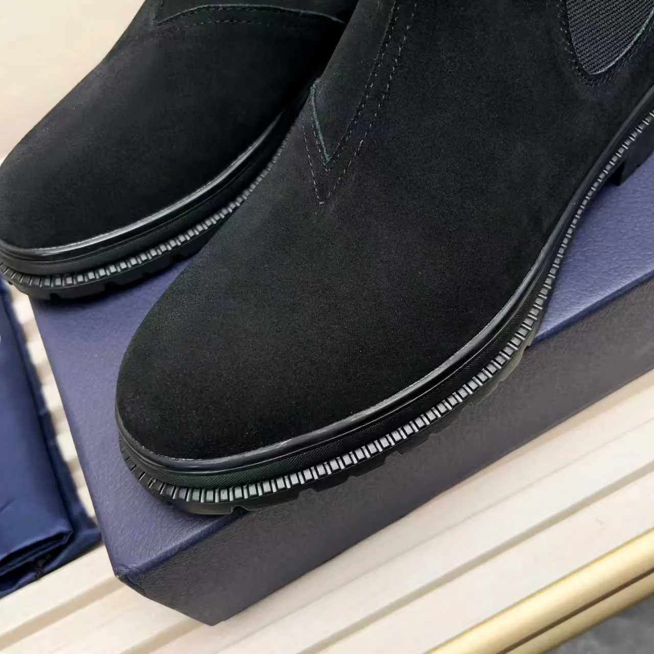 Men's Shoes 💰480 Dior A practical choice that combines protection with classic style. Made from durable Rugged Calf leather, it's tumbled and hand-finished to create a soft suede feel with a rich texture. Elastic side panels and subtle cutouts are inspired by the classic Chelsea boot. Leather upper and lining with Kummel tabs at front and rear, rubber outsole